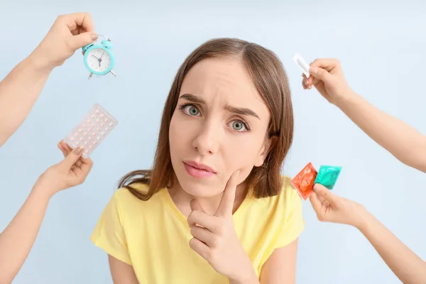 Thoughtful Young Woman Hands Different Means Contraception Color Background — Stock Photo, Image