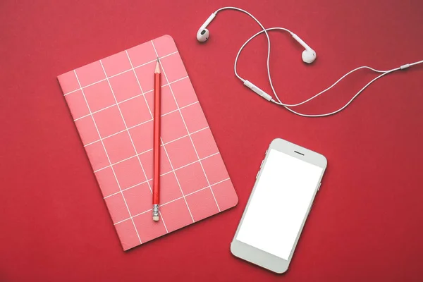 Modern Mobile Phone Earphones Notebook Pencil Color Background — Stock Photo, Image