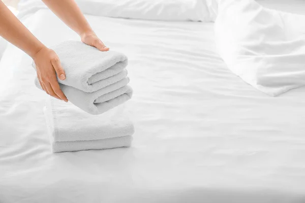 Woman Putting Clean Towels Bed Home — Stock Photo, Image