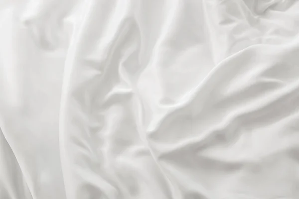 Soft white sheet on bed