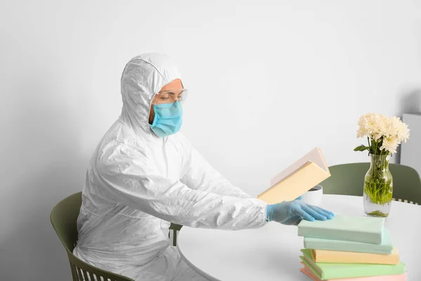 Man Biohazard Suit Reading Book Home — Stock Photo, Image