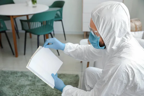 Man Biohazard Suit Reading Book Home — Stock Photo, Image