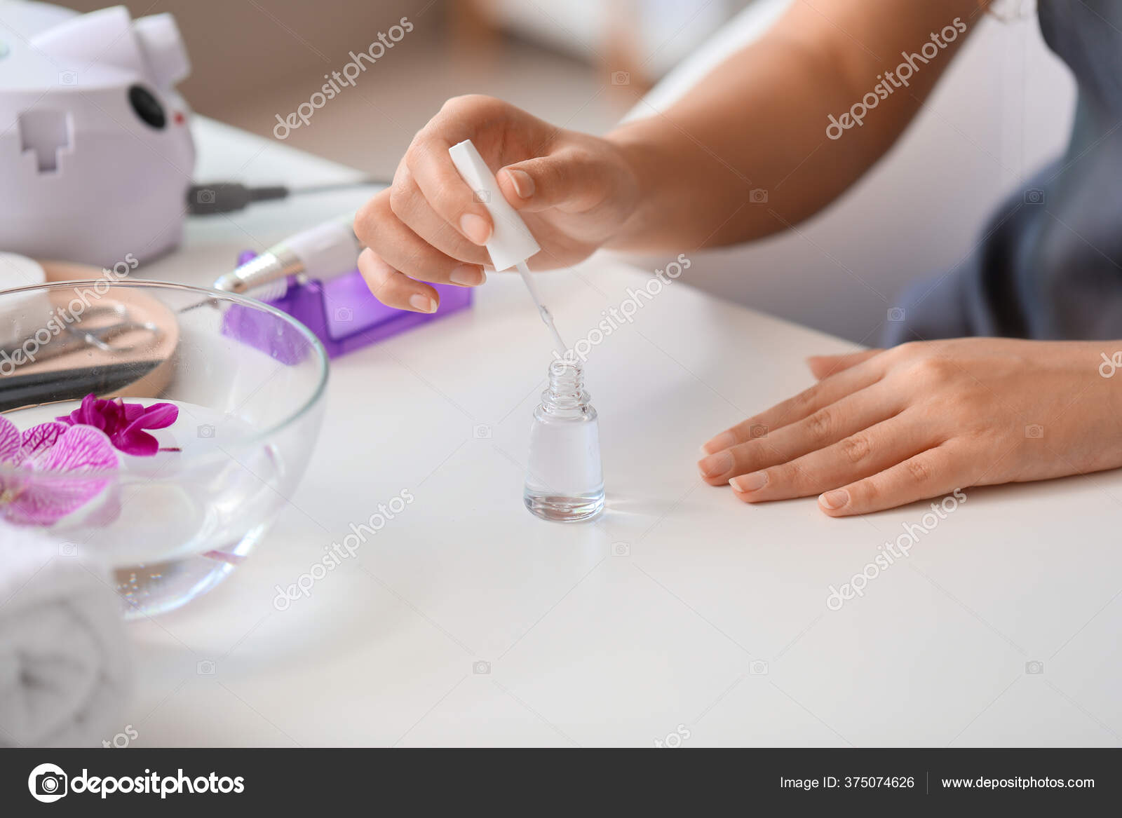 Woman Applying Gel Polish Her Nails Closeup Stock Photo by ©serezniy