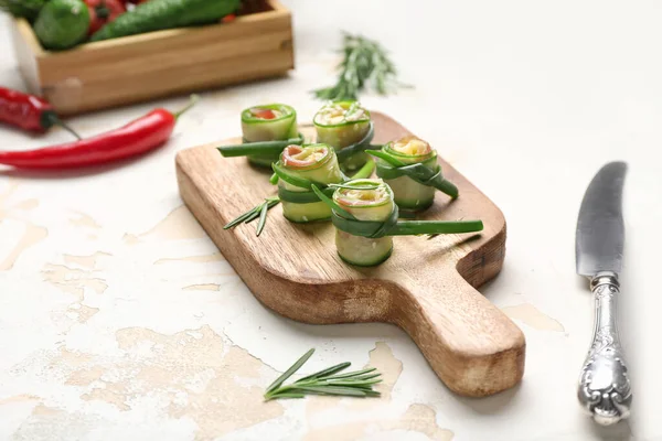 Board Tasty Cucumber Rolls Light Background — Stock Photo, Image