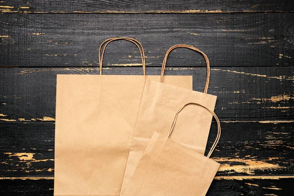Paper Shopping Bags Dark Wooden Background — Stock Photo, Image
