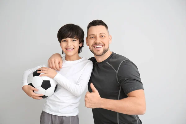 Father Little Son Soccer Ball Grey Background — Stock Photo, Image