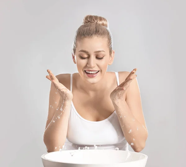 Woman Washing Face Grey Background — Stock Photo, Image