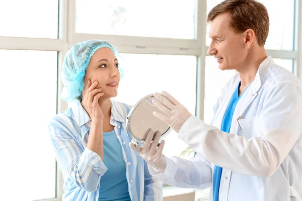 Plastic Surgeon Showing Woman Her Reflection Mirror — Stock Photo, Image