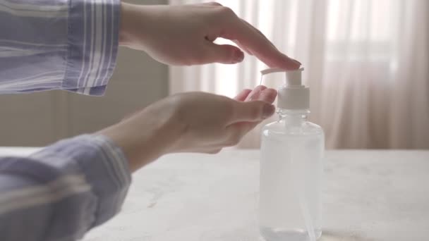 Woman Using Sanitizer Home — Stock Video