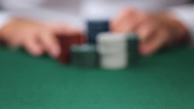 Man playing poker in casino, closeup