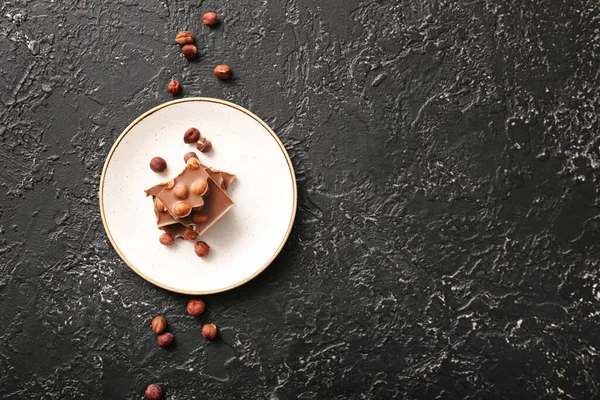 Plate Tasty Chocolate Hazelnuts Dark Background — Stock Photo, Image