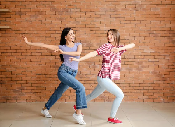 Beautiful Young Women Dancing Brick Wall — Stock Photo, Image