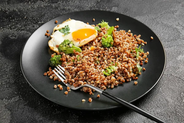 Plate Tasty Buckwheat Porridge Egg Broccoli Dark Background — Stock Photo, Image