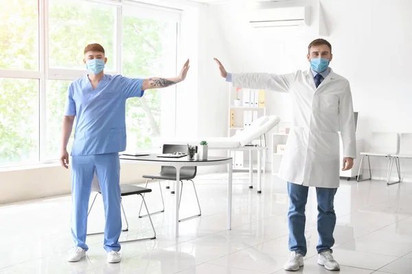 Doctors Wearing Protective Masks Clinic Concept Social Distance — Stock Photo, Image