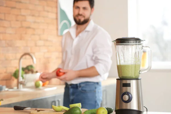 Blender and products on kitchen table