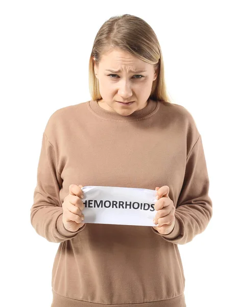 Jonge Vrouw Met Papier Met Tekst Hemorrhoids Witte Achtergrond — Stockfoto