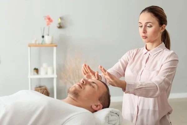 Reiki Master Working With Patient Chakra Wellness Stock Photo