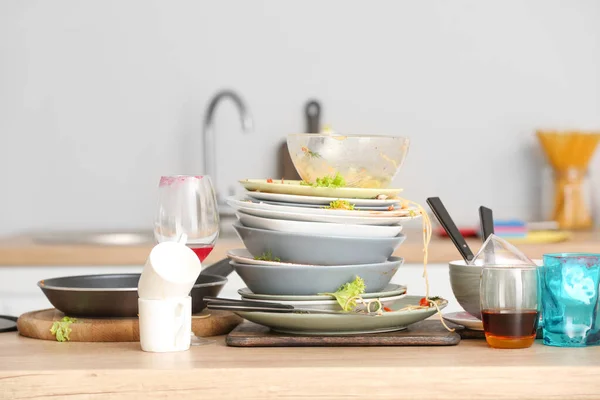 Pile Of Dirty Dishes On Kitchen Table Pan Housework Stock Photo 355901656