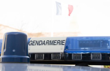 rotating beacon on gendarmerie vehicle clipart