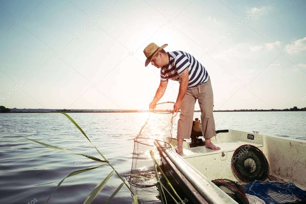 Fisherman checking the net for a catch