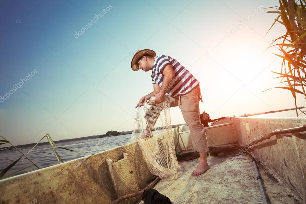 Fisherman checking the net for a catch