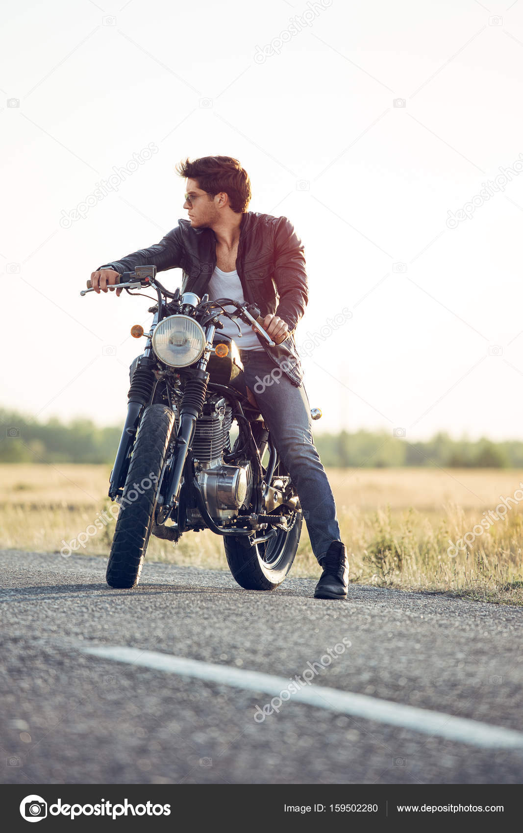 Biker riding his motorcycle — Stock Photo © zorandim #159502280