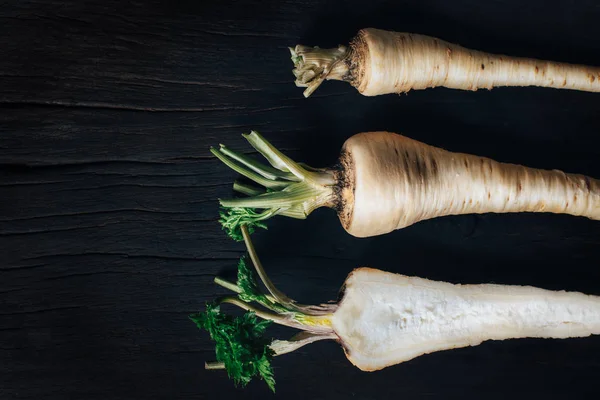 Fresh parsley root on wooden table — Stock Photo, Image