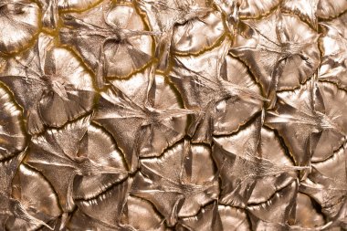 Siyah zemin üzerine altın ananas dilimleri