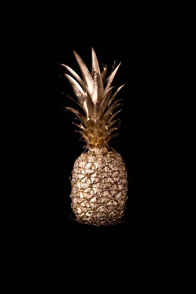 Gold pineapple  on black background