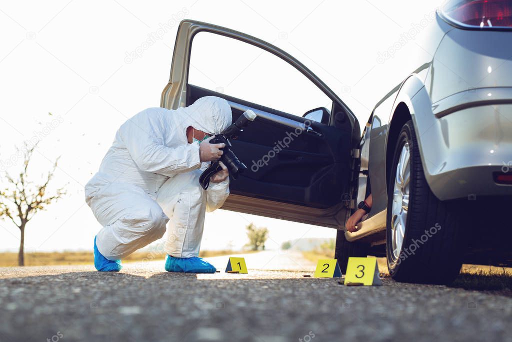 Forensic Science. Criminologist investigates a crime scene.