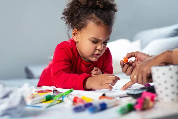 Happy African American Mother Assisting Her Daughter Coloring — Stock Photo, Image