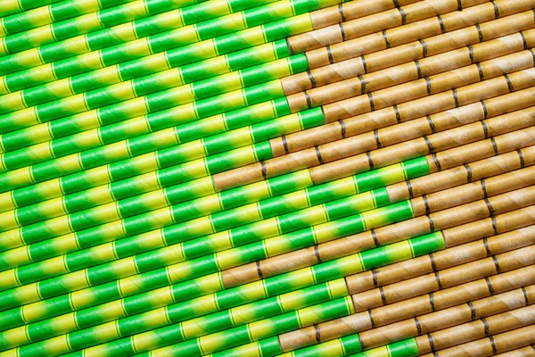 Paper straws painted to look like bamboo straws.