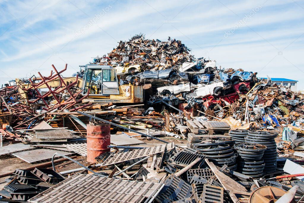 Crushed cars stacked up for recycling. 