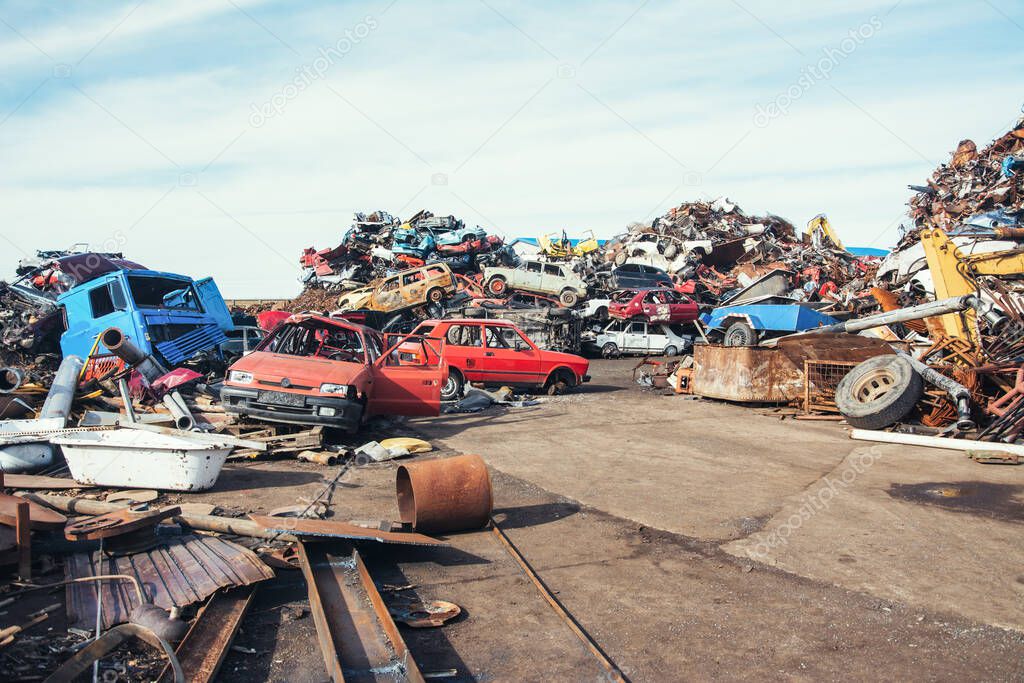 Crushed cars stacked up for recycling. 