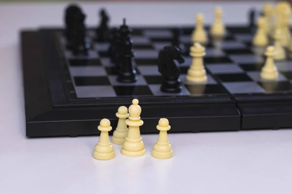 Chess is on a chessboard. Learning to play chess, the development of logic, a photo.