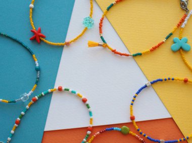 Bracelet and Necklace : Mixed beads with various materials  isolated on color paper