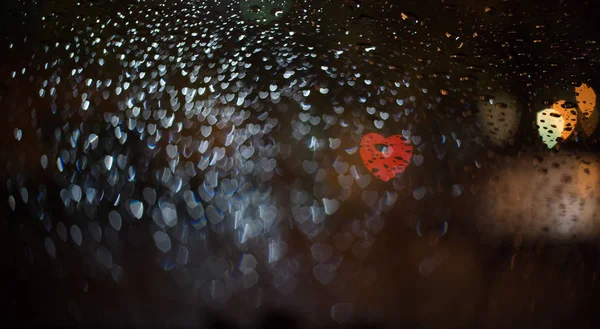 Astratto macinato nero sfocato con cuore bokeh luci sfocate — Foto Stock