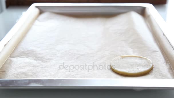 Female hands lay out the dough  to  the baking tray — Stock Video