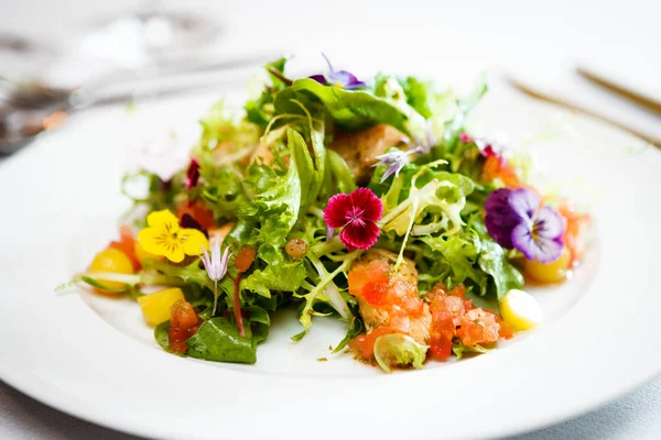 Green salad on a white plate — Stock Photo, Image