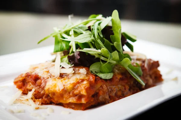 Lasagna with salad — Stock Photo, Image