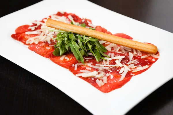 Meat carpaccio with Parmesan — Stock Photo, Image