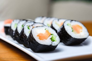 Smoked salmon rolls served on a plate