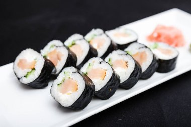 Smoked salmon rolls served on a plate