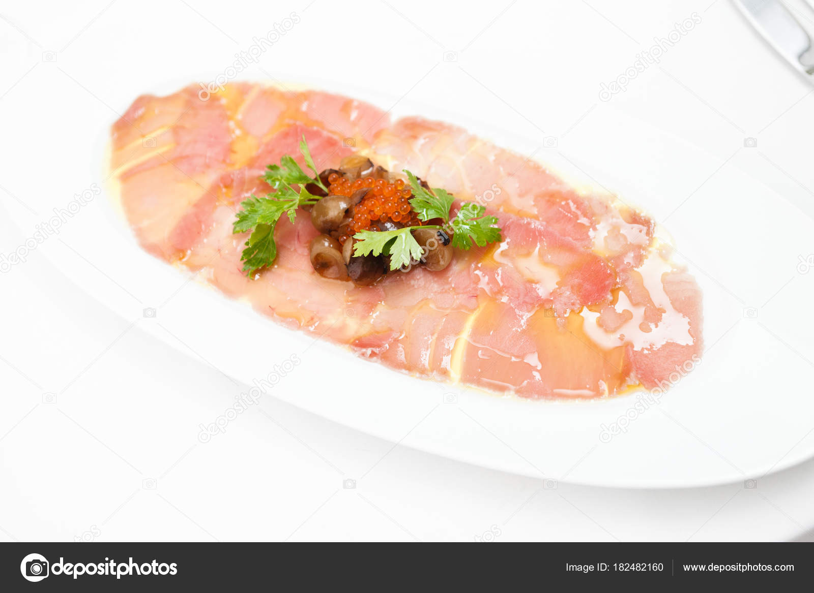 Salmon carpaccio with rocket salad Stock Photo by ©mtoome 182482160