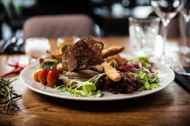 Meat platter for two served on a plate in restaurant