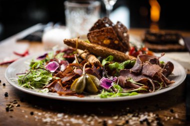 Meat platter for two served on a plate in restaurant