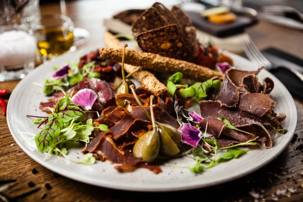 Meat platter for two served on a plate in restaurant — Stok fotoğraf