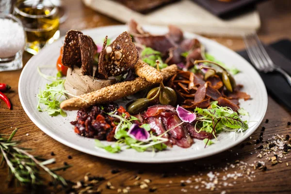 Meat platter for two served on a plate in restaurant — Stock fotografie