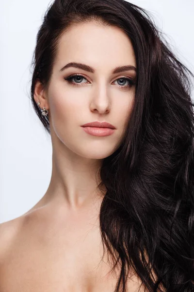 Portrait of a young lady with beautiful brunette hair on white — Stok fotoğraf