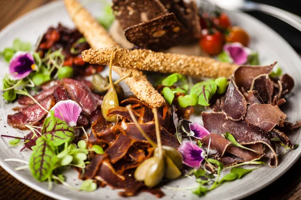 Meat platter for two served on a plate in restaurant — Stock Photo, Image